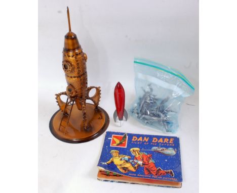 A Sci-fi related group to include a Rooster Productions metal and handpainted model of a rocket, together with a tinplate roc