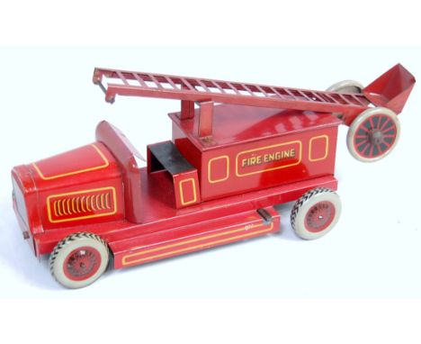 A Chad Valley Ubuilda tinplate and clockwork fire engine comprising red body with tinprinted yellow decoration with balloon t