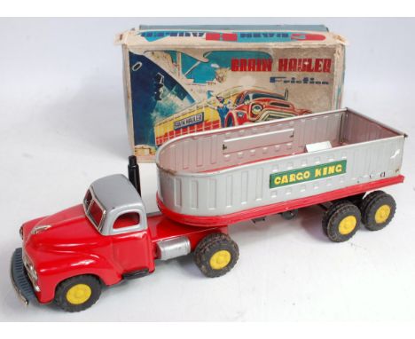 A Yamazaki of Japan tinplate and friction drive Cargo King grain hauler, comprising red and silver body with matching trailer