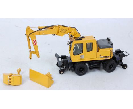 An NZG No. 544 1/50 scale of a Liebherr 900 road/rail excavator with extended cab, knuckle boom and two buckets, loose exampl