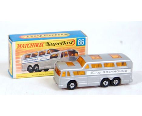 A Matchbox Superfast No. 66 Greyhound coach comprising silver body with amber glass and rare pink painted base, in the origin