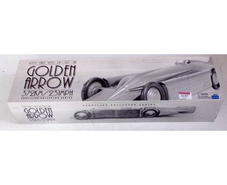 A Schylling Collectors Series tinplate and clockwork model of a 1929 Golden Arrow landspeed record car, in original all-card 