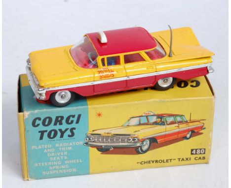 A Corgi Toys No. 480 Chevrolet taxi cab comprising red & yellow body with spun hubs and red interior with taxi roof light in 