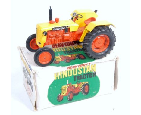 A Maxwell Company of India diecast model of a Hindustan tractor, comprising orange and yellow body with orange hubs and black