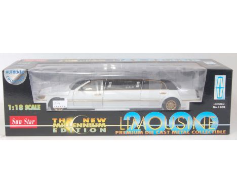 A Sunstar 1/18 scale model of a No. 1269 The New Millennium Edition limousine 2000 finished in black, white and gold, in the 