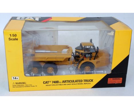 A Norscot No. 55500 1/50 scale model of a Caterpillar 740B articulated truck  with ejector in the original window box