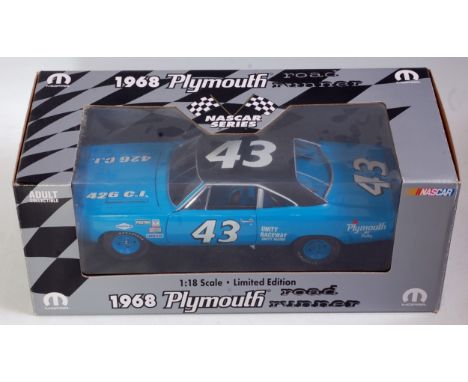 A Mopar Nascar 1/18 scale limited edition model of a 1968 Plymouth Road Runner finished in blue and black with blue racing hu