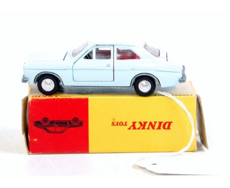 A Dinky Toys No.168 Ford Escort, comprising light blue body, red interior with detailed spun hubs, in the original all-card b