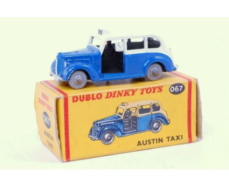 A Dublo Dinky Toys 067 Austin Taxi comprising cream and blue body with grey plastic wheels in the original all-card box (NM-B