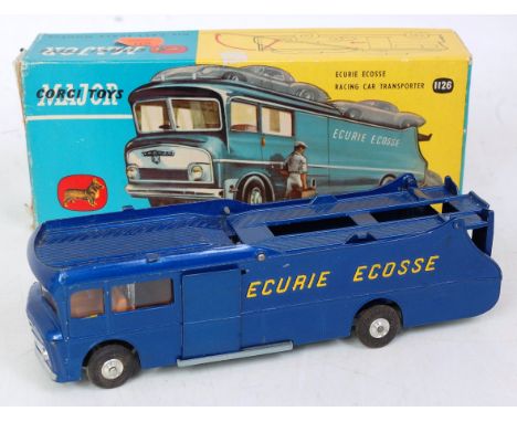 A Corgi Toys No. 1126 The Courier Coaster Racing car transporter comprising metallic blue body with yellow lettering and spun