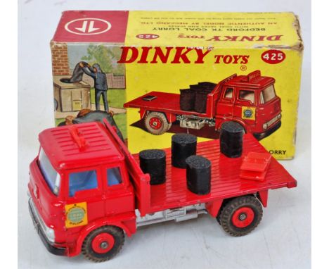 A Dinky Toys No. 425 Bedford TK coal lorry comprising red and silver body with red plastic hubs with four coal sacks and set 