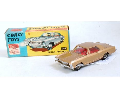 A Corgi Toys No. 245 Buick Riviera comprising gold body with red interior and wirework detailed hubs in the original blue and