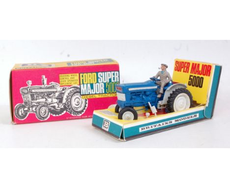 A Britains No. 9527 Ford Super Major 5000 diesel tractor, finished in blue and grey with grey hubs, appears complete with air
