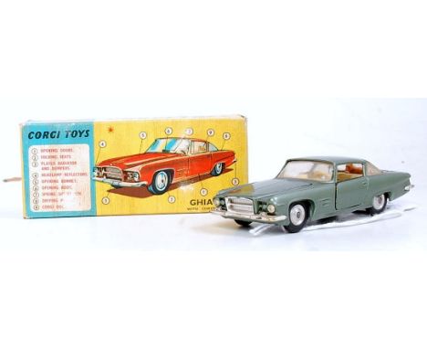 A Corgi Toys No. 241 Ghia with Chrysler engine L.6.4 comprising metallic sage green body with cream interior with spun hubs i