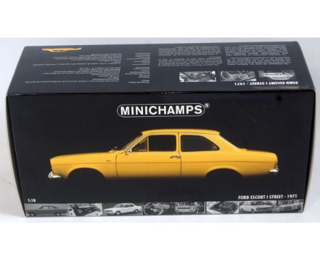 A Minichamps 1/18 scale model of a Ford Escort I Street, 1971, finished in yellow, in the original foam packed all-card box (