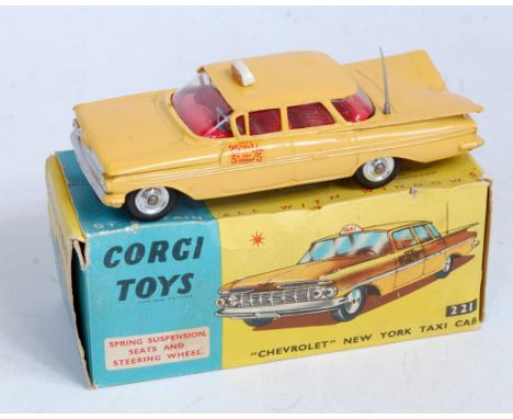 A Corgi Toys No. 221 Chevrolet New York taxi cab comprising yellow body with red interior and spun hubs, with suspension, in 