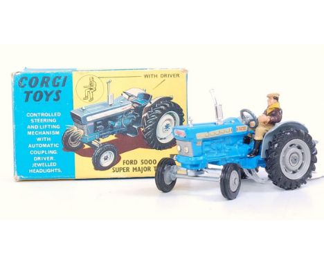 A Corgi Toys No. 53 Massey Ferguson 65 tractor with shovel, comprising red and cream body with red hubs, in the original blue