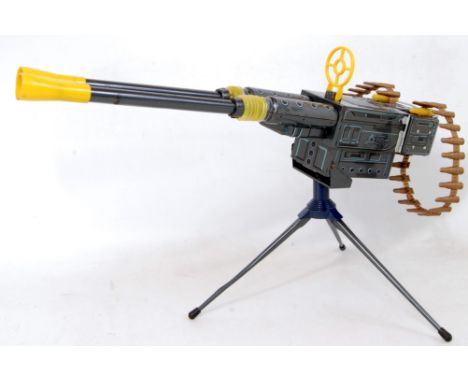 A modern Toys of Japan tinplate and battery operated machine gun comprising of silver, blue and black tinprinted body with tw