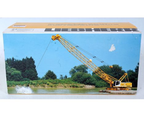 A Conrad No. 2732 1/50 scale model of a Liebherr HS843HD hydraulic crawler crane with dragline bucket attachment, in the orig