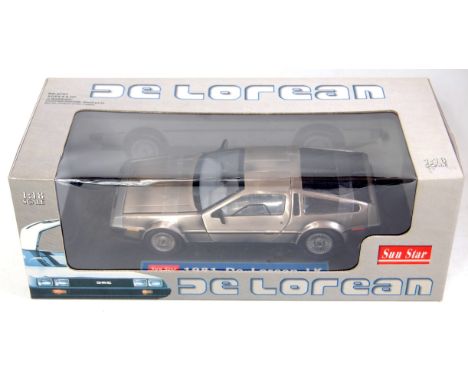 A Sunstar 1/18 scale model of a De Lorean 1981 LK finished in brushed silver, in the original De Lorean branded window box (M