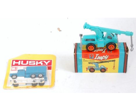 A diecast group to include a Husky No. 13 Guy Warrior sand truck finished in blue with chrome hubs and on the original backin