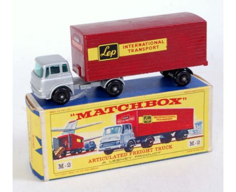 A Matchbox Major Series M2 LEP International Transport Articulated Freight truck comprising silver cab and chassis with maroo