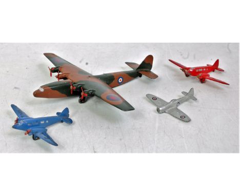 Four various loose Dinky Toys aircraft, to include an Ensign Class airliner, blue light transport plane, red light transport 