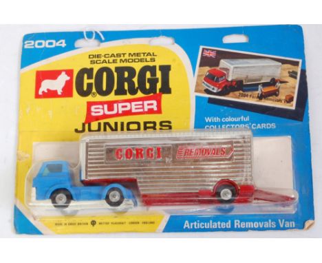 A Corgi Super Juniors No.2004 Ford articulated removals van, comprising blue cab and chassis, with red and silver back, on th