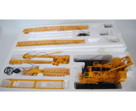 An XCMG 1/50 scale model of a Quy 300 Crawler crane with fly jib, pre-rigged example, in the original polystyrene packed whit