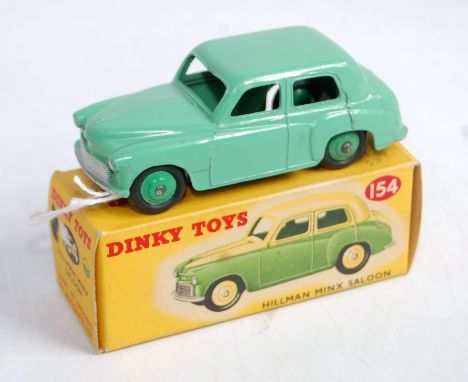 A Dinky Toys No. 154 Hillman Minx saloon comprising light green body with mid green hubs in the original incorrect colour spo