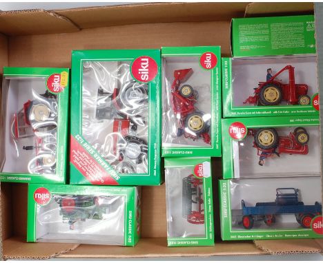 Nine various boxed Siku 1/32 scale farming diecast and implements, all in original green window boxes, reference numbers to i