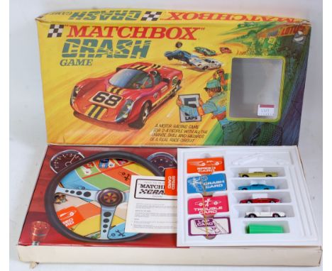 A Matchbox Crash Game comprising four various Superfast diecast vehicles, die and shaker, various playable game cards, instru