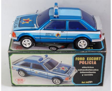 An EGE Spanish tinplate and battery operated Ford Escort XR3 Police car comprising  tin printed blue, light blue and white bo