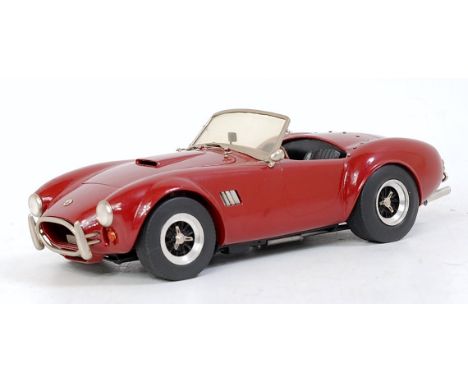 A Classic Lines 1/24 scale white metal kit built model of an AC Cobra 427, model No.3, finished in maroon, loose example (VG)