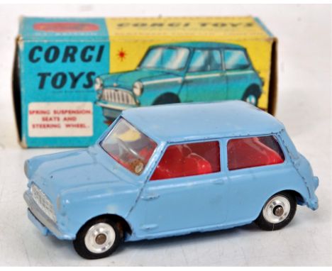 A Corgi Toys No. 226 Morris Mini Minor comprising light blue body with red interior and spun hubs in the original blue & yell