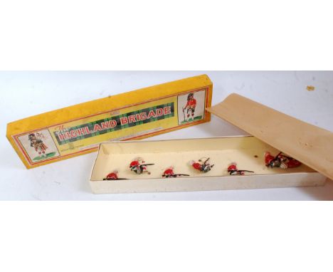 A John Hilco No. 124 Highland Brigade boxed soldier set, comprising of 7 kneeling Highland Brigade troops with rifles, in the