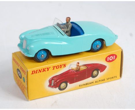 A Dinky Toys No. 101 Sunbeam Alpine sports car comprising light blue body with dark blue interior and mid blue hubs in the co