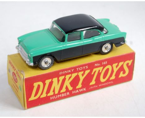 A Dinky Toys No. 165 Humber Hawk comprising light green and black body with spun hubs in the original correct colour spot all