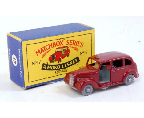 A Matchbox 1/75 series No. 17A Metropolitan Taxi comprising brown body with grey plastic hubs and driver figure in the origin