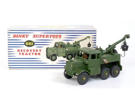 A Dinky Toys No. 661 Military Recovery tractor comprising military green body with military green hubs, in the original blue 