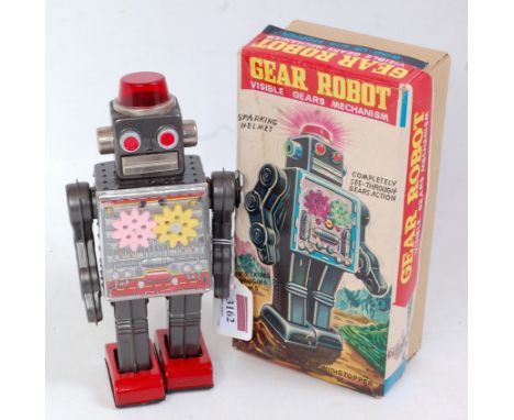 SH Toys of Japan, tinplate and clockwork operated Gear Robot, grey/silver body with red feet, fixed key mechanism, in the ori