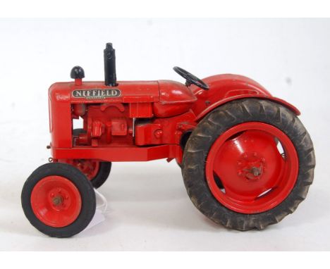 A Denzel Skinner Co Ltd for Morris Motors Agricultural Dept diecast model of a Nuffield Universal tractor, rear linkage has b