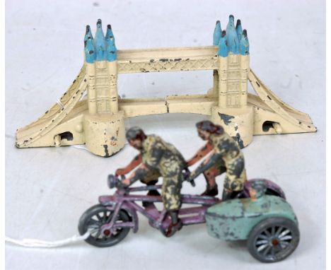 A Morestone tandem tricycle with male and female riders and sidecar with child, also sold with a pre-war Taylor & Barratt tow