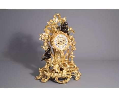An impressive French gilt and patinated bronze Rococo revival mantel clock, 19th/20th C. -- Description: H 65 cm