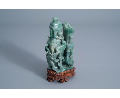 A Chinese green jade vase and cover with birds among blossoming branches on a wooden stand, 20th C. -- Description: H 27,2 - 