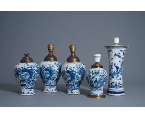Five Dutch Delft blue and white lamp mounted vases, 18th C. -- Description: H 38,5 - 27,5 cm (the tallest and the smallest it