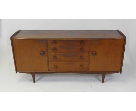 John Herbert for A. Younger Ltd - a 1960s teak Volany sideboard, having a slightly curved top over four graduated central dra