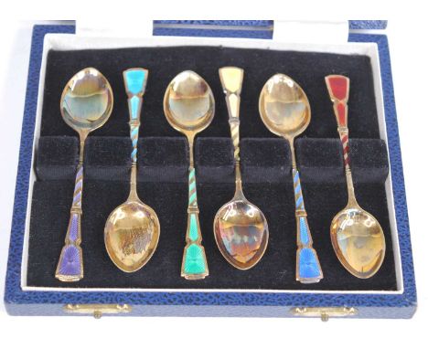 A cased set of six 1970s silver-gilt enamelled teaspoons in the Art Deco taste, the front of each stem cloisonne enamel decor