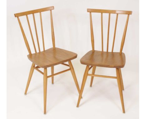 A pair of Ercol model 391 light elm stickback kitchen chairs, each on plain turned and slightly tapering supports, w.40cm