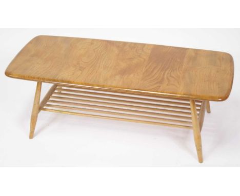 A 1960s Ercol Windsor light elm coffee table, having rounded corners and laddered undertier, h.36.5cm, length 105cm, depth 46